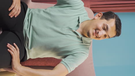 Vertical-video-of-Relaxed-man-happy-and-peaceful.